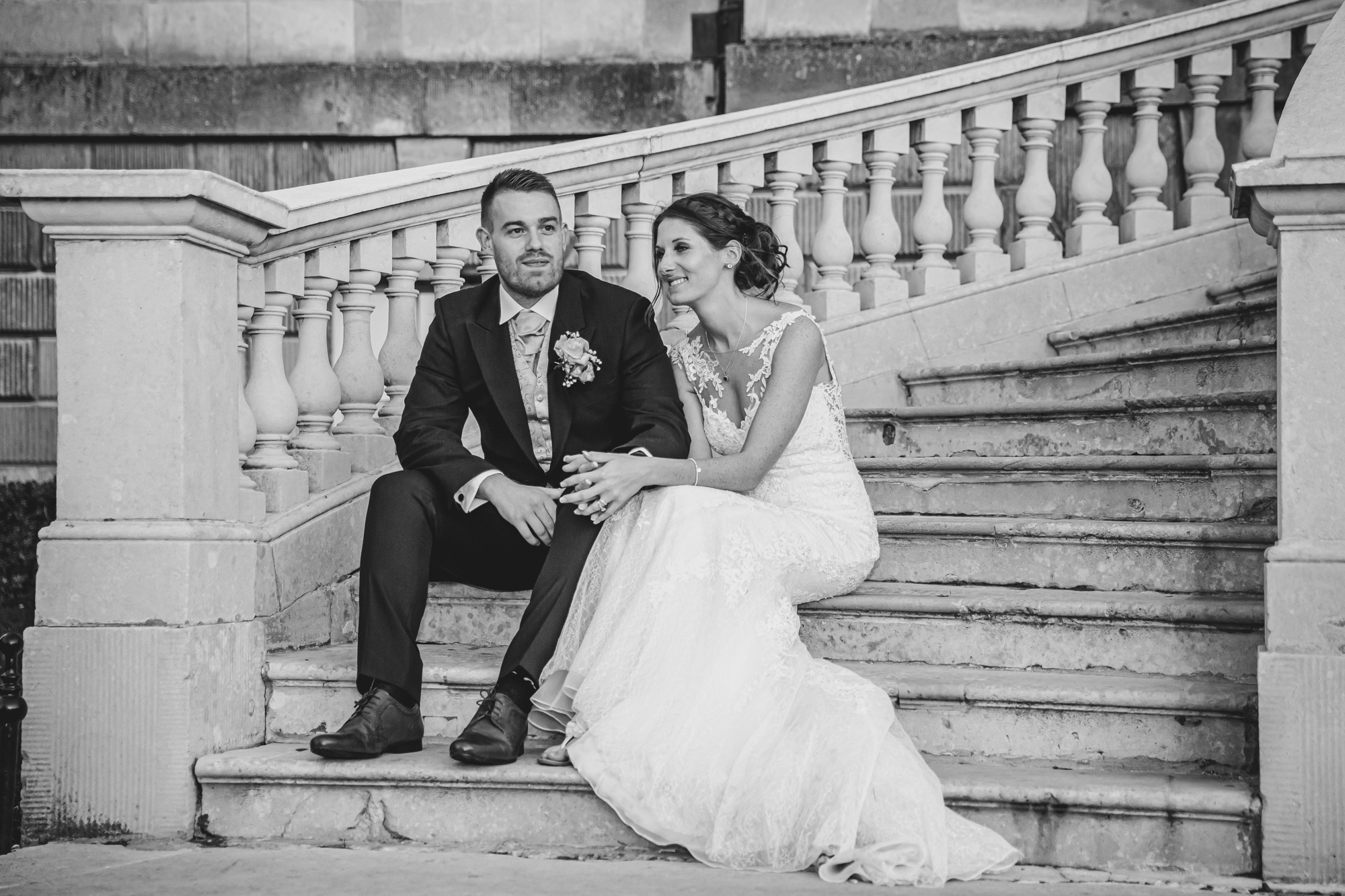 Bride & Groom on steps sharing a quiet moment