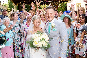 Bride & Groom being showered with confetti