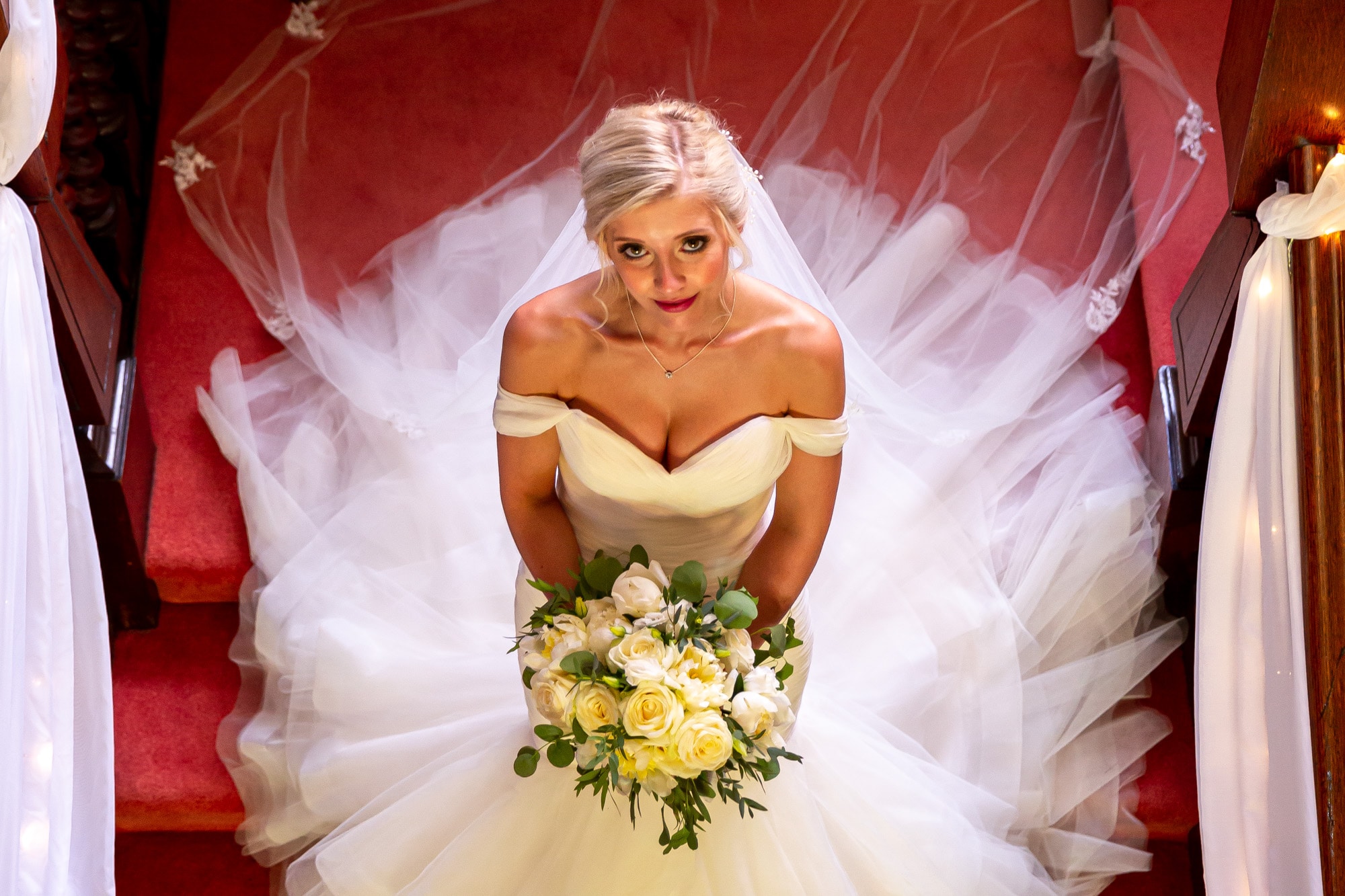 Bride on stairs looking up